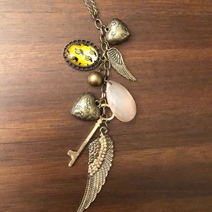 Multi-charmed gold necklace